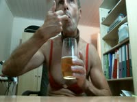 Guy that enjoys crossdressing in sexy lingerie explores piss drinking for his live cam viewers